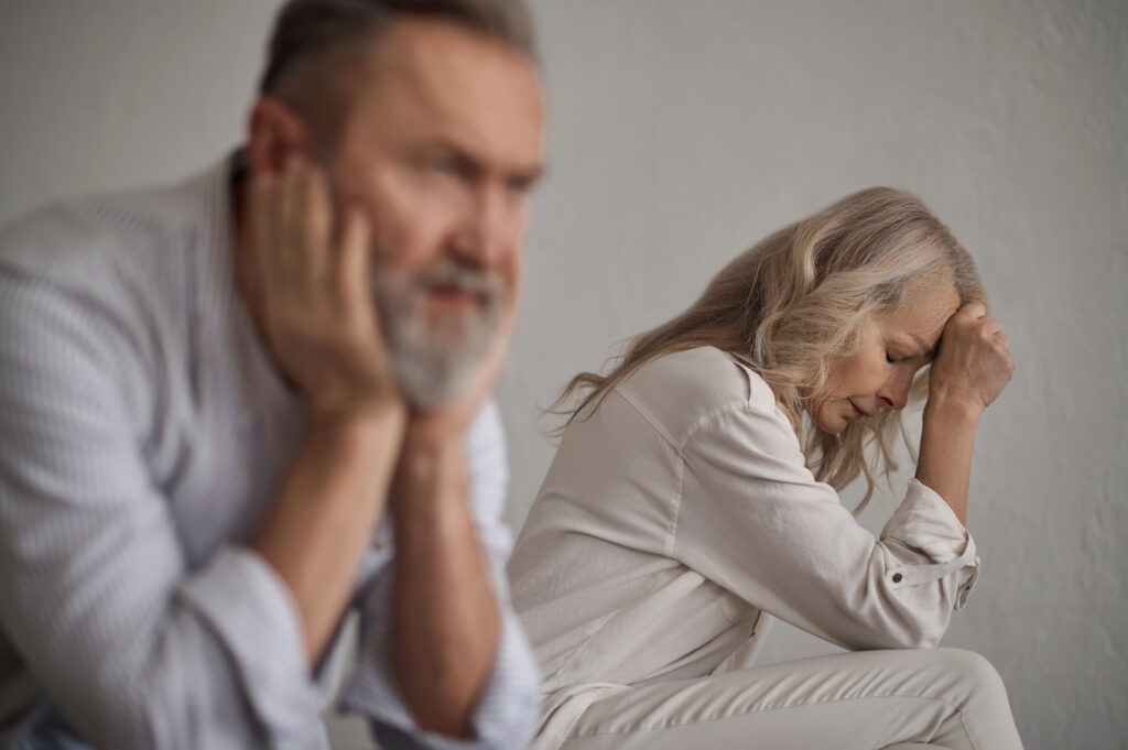 Mature couple ignoring one another after a conflict